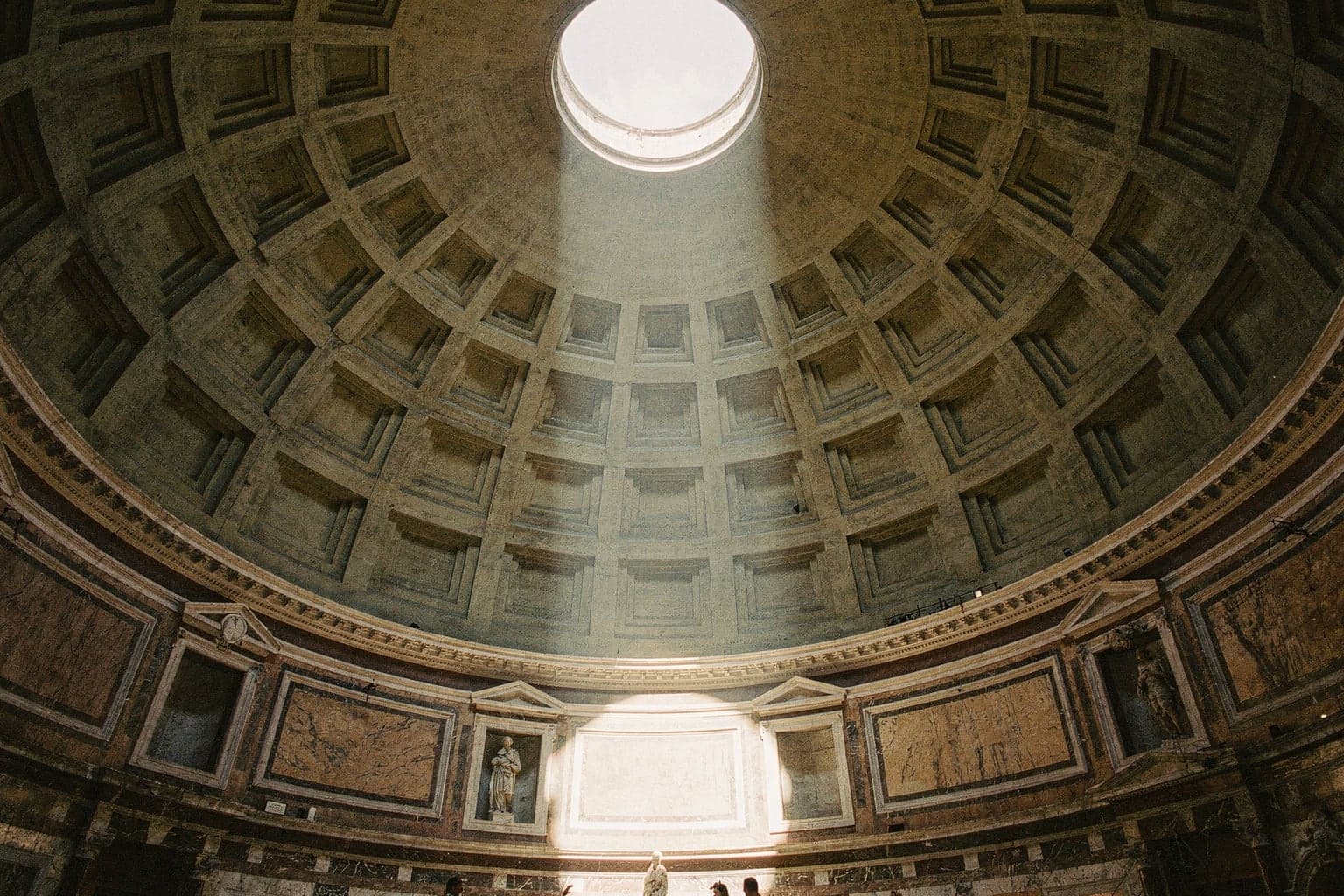 The Pantheon's columned portico and the fountain in Piazza della Rotonda in early-morning light